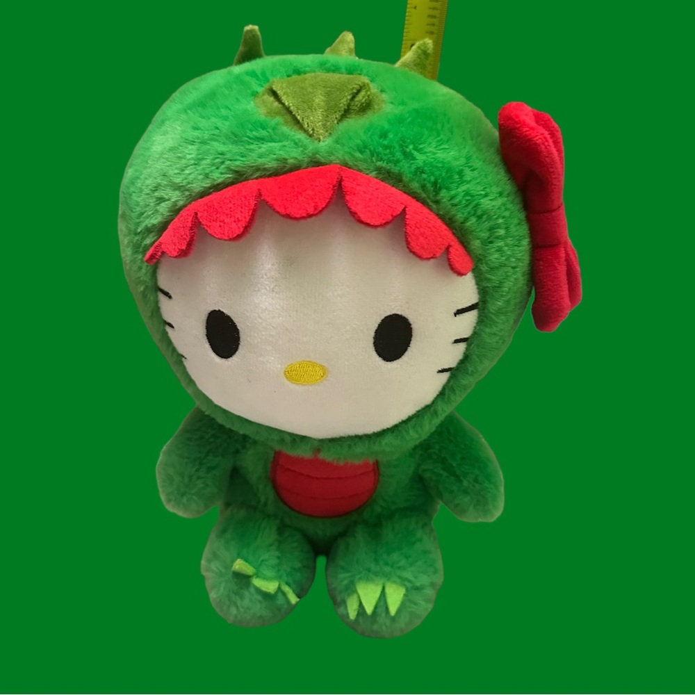 Hello Kitty Plush in Green Dinosaur Outfit with Red Accents